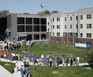 Crowd gathering in celebration of the opening of the Residence Hall